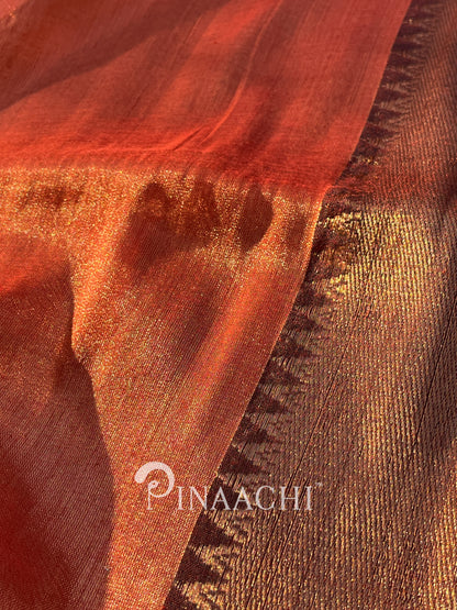 Handloom orange red tissue silk saree by Pinaachi showcasing elegant shimmer and texture