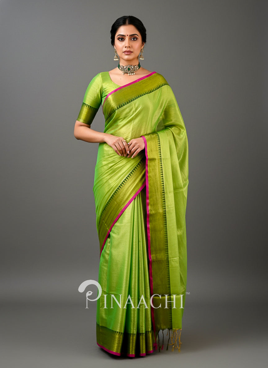 Vibrant green handloom tissue silk saree with contrasting pink border by Pinaachi