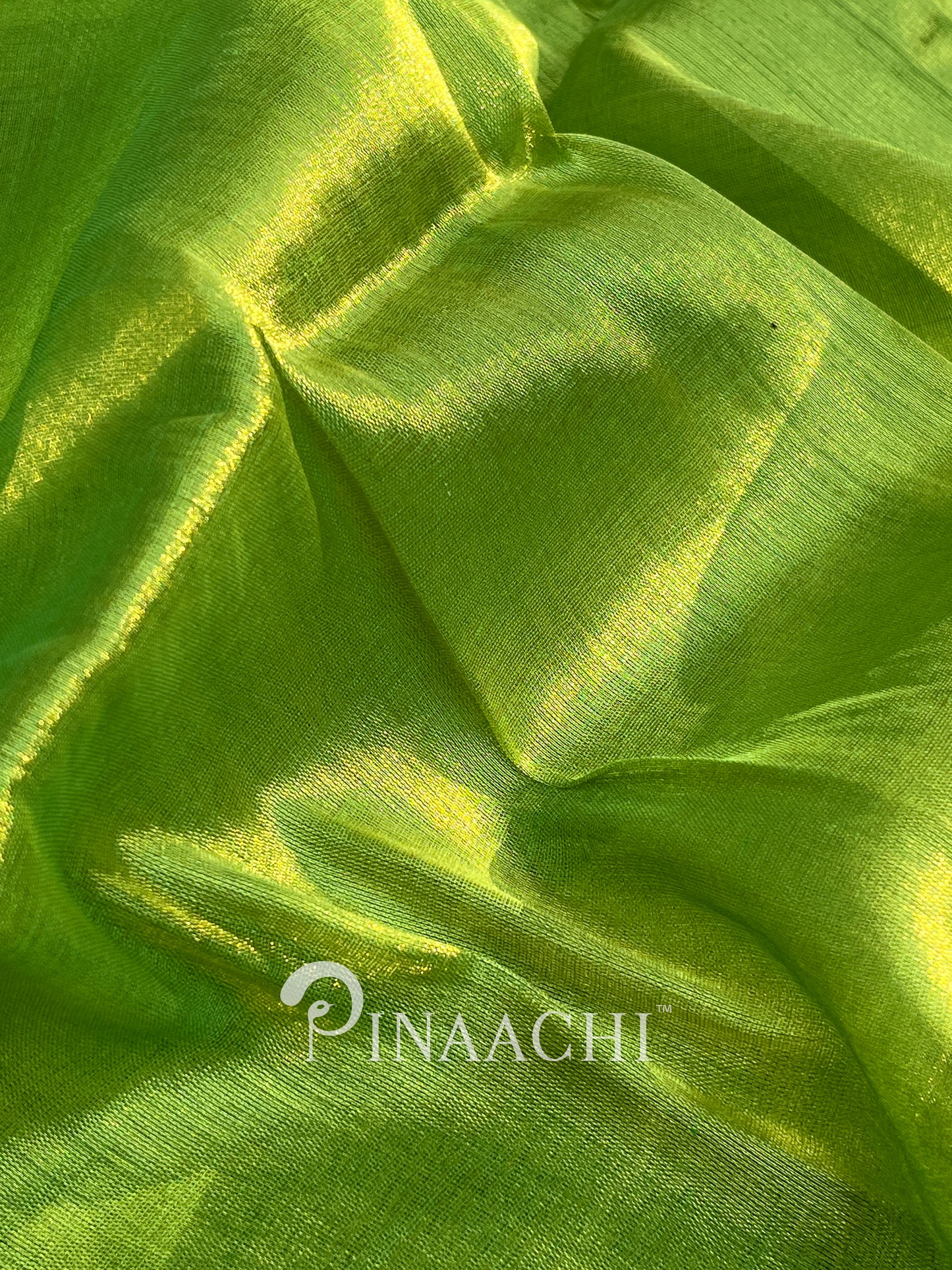 Vibrant green handloom tissue silk saree by Pinaachi, showcasing a luxurious sheen and soft texture