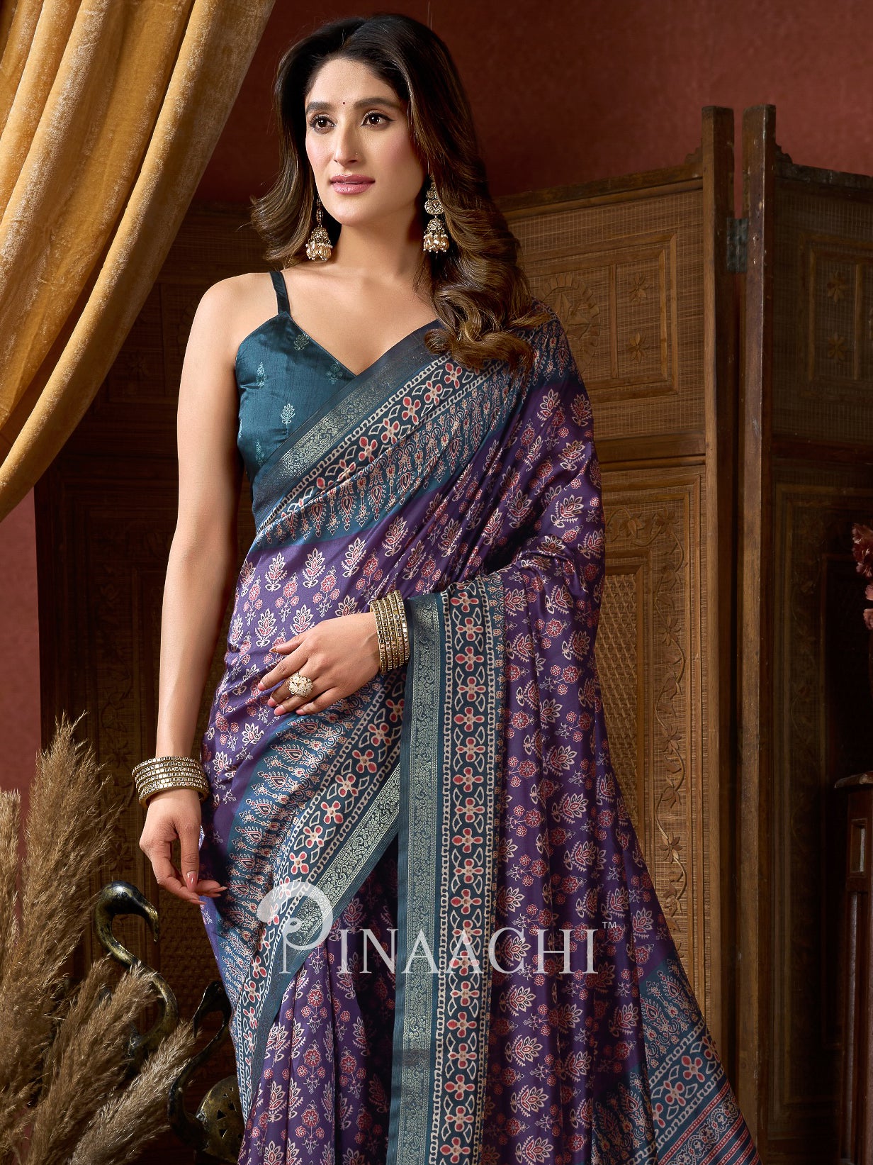 Pinaachi ajrak indigo silk saree with intricate patterns and contrasting blouse for elegant wear