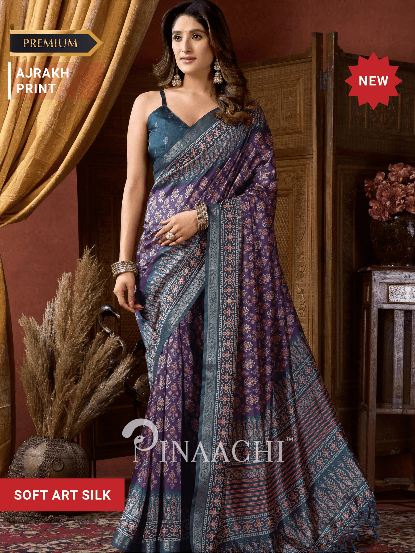Pinaachi ajrak indigo silk saree with intricate patterns and elegant draping for festive occasions