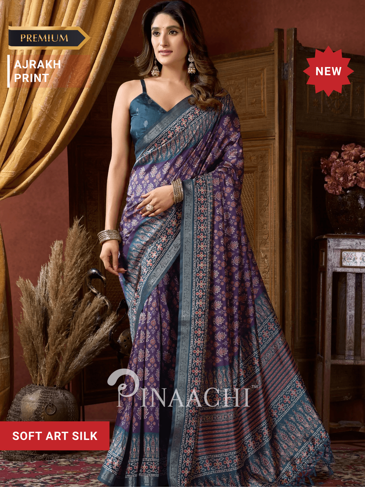 Pinaachi ajrak indigo silk saree with intricate patterns and elegant draping for festive occasions