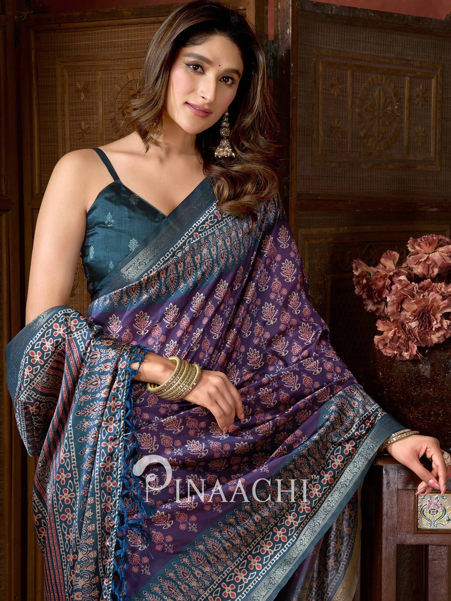 Pinaachi ajrak indigo silk saree with intricate floral patterns and elegant border design