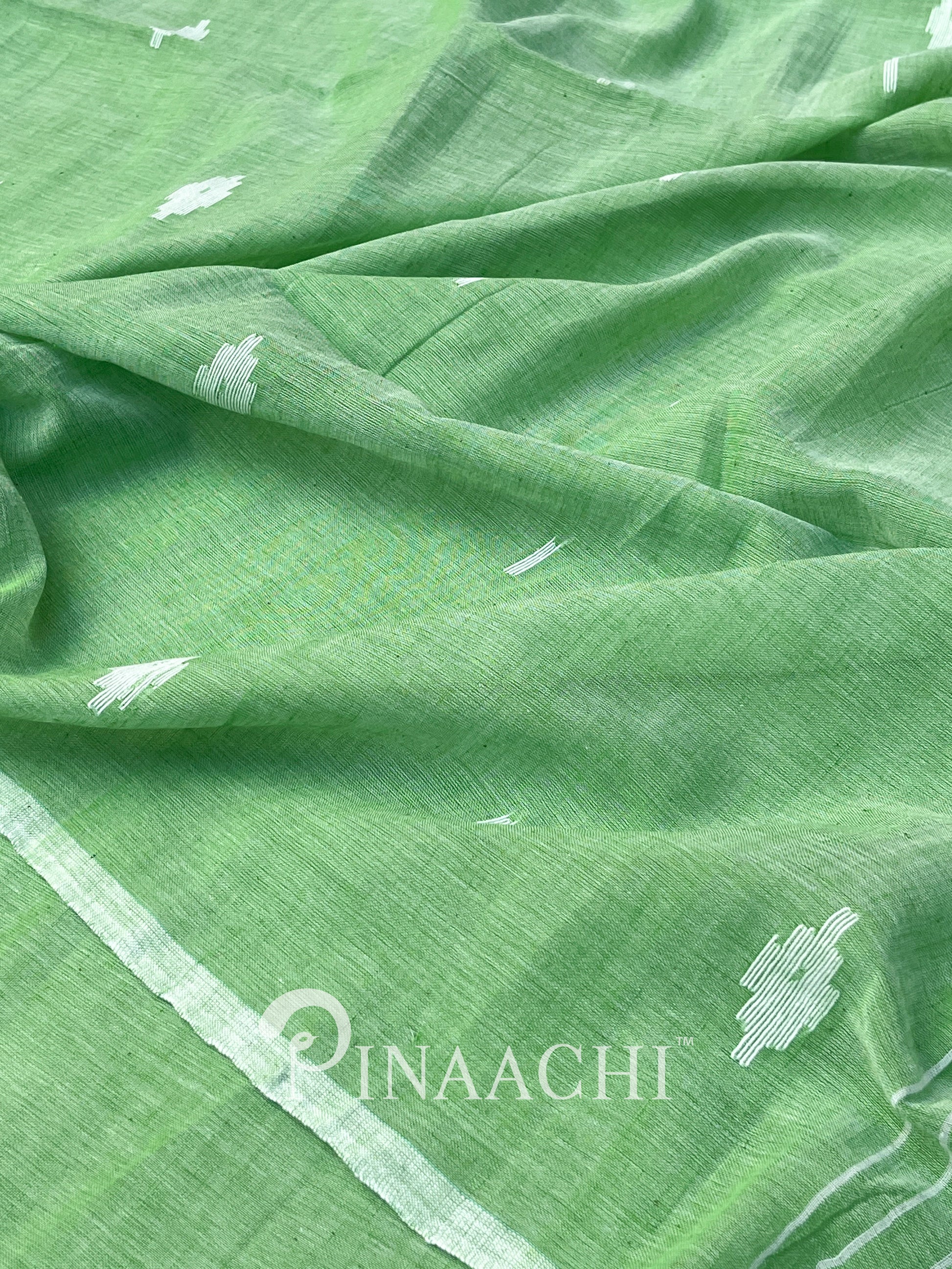 Pinaachi light green mulmul jamdani saree with delicate white motifs for elegant occasions