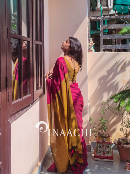 Elegant magenta pink cotton handloom saree draped stylishly, perfect for special occasions