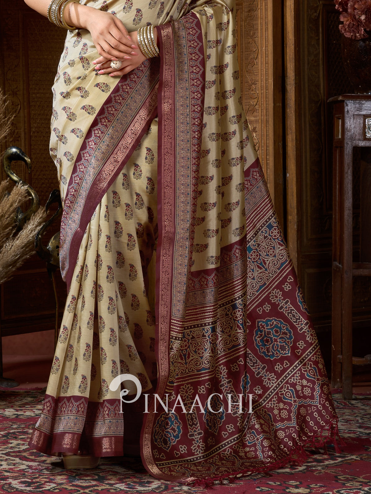 Pinaachi beige-red Ajrakh art silk saree with intricate patterns and rich detailing