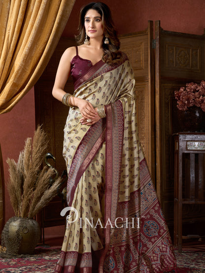 Pinaachi beige Ajrakh art silk saree with intricate patterns and contrasting maroon border