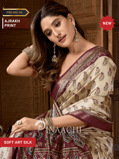 Pinaachi cream Ajrakh art silk saree with intricate print and maroon border for elegant occasions
