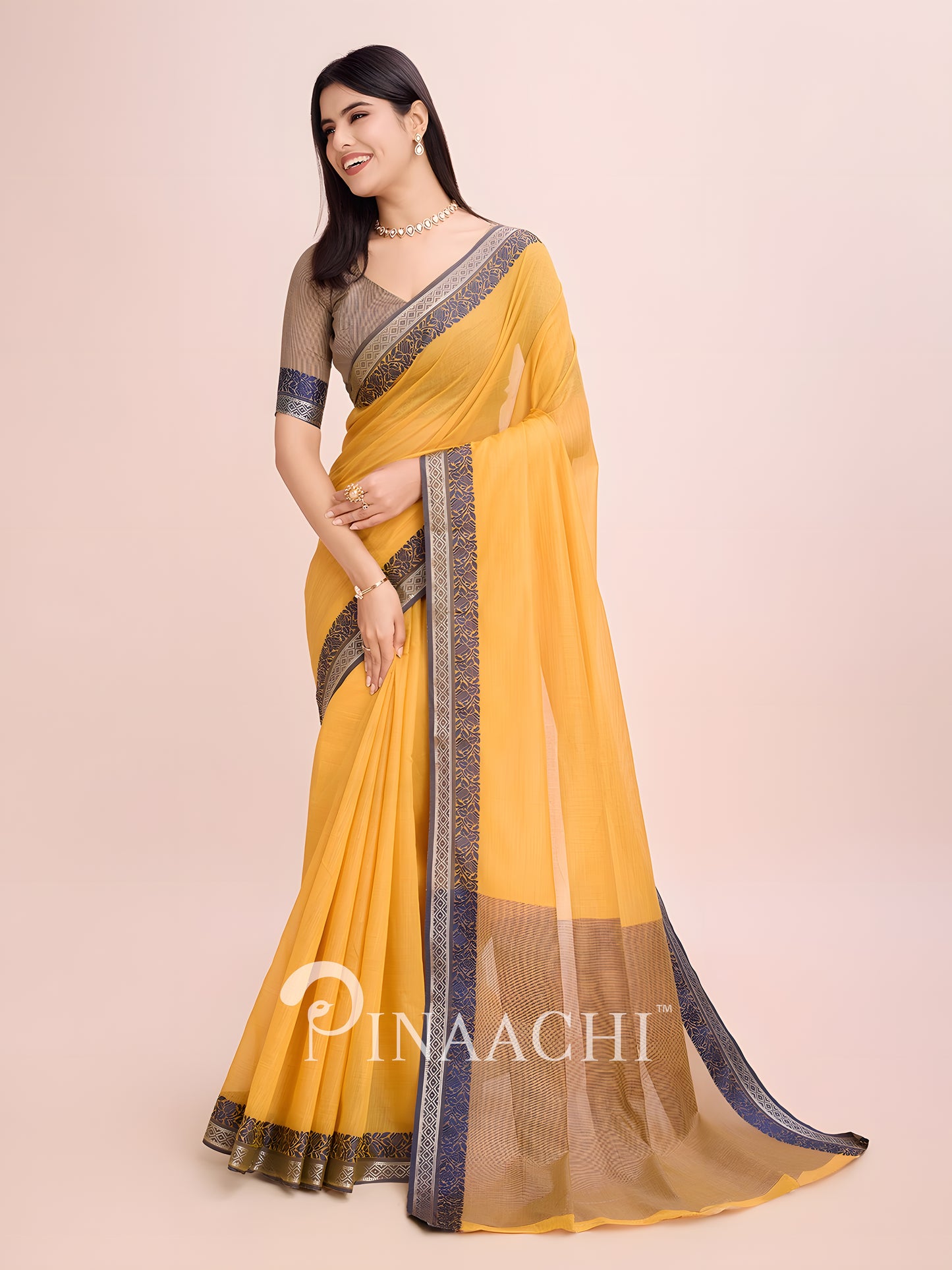 Elegant mustard cotton saree with woven border, styled with a matching blouse for a classic look
