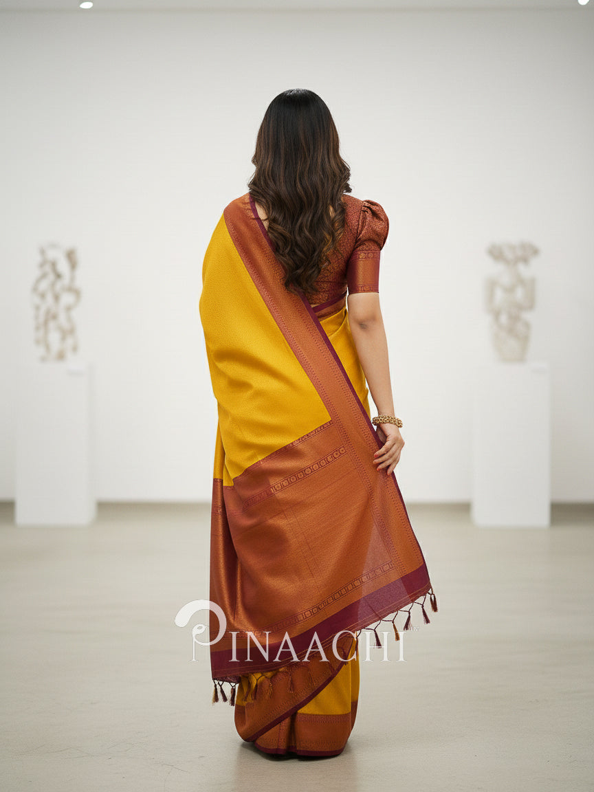 Pinaachi mustard maroon silk saree online with elegant drape and tassel detailing