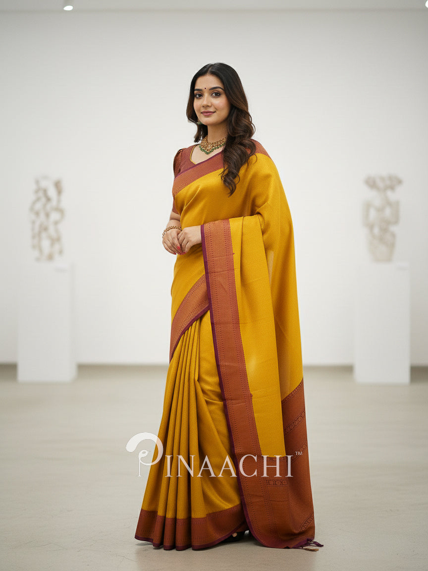Pinaachi mustard maroon silk saree online with elegant drape and contrasting borders