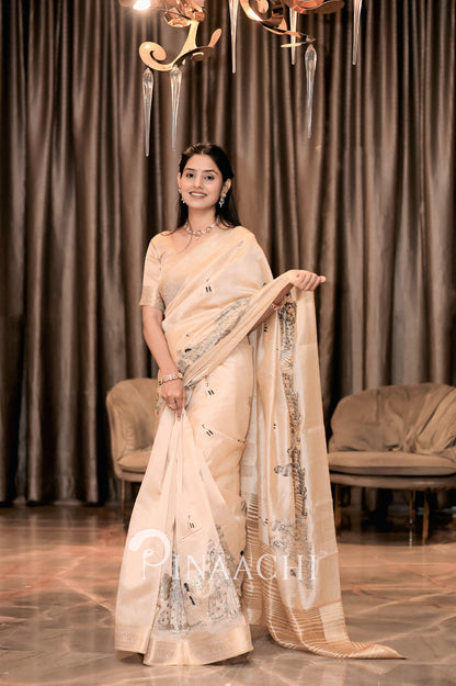 Elegant off-white tussar silk saree by Pinaachi with intricate detailing and shimmering fabric