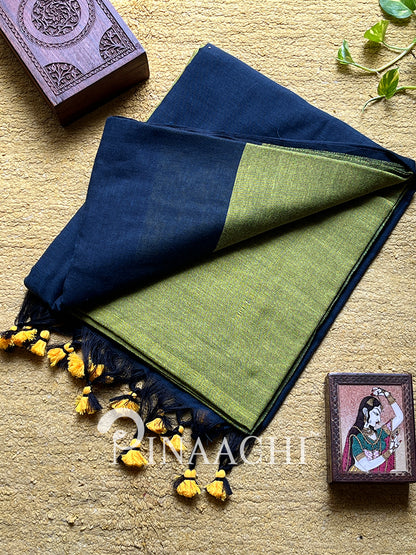 Olive green handloom cotton saree with a contrasting dark border and traditional tassels