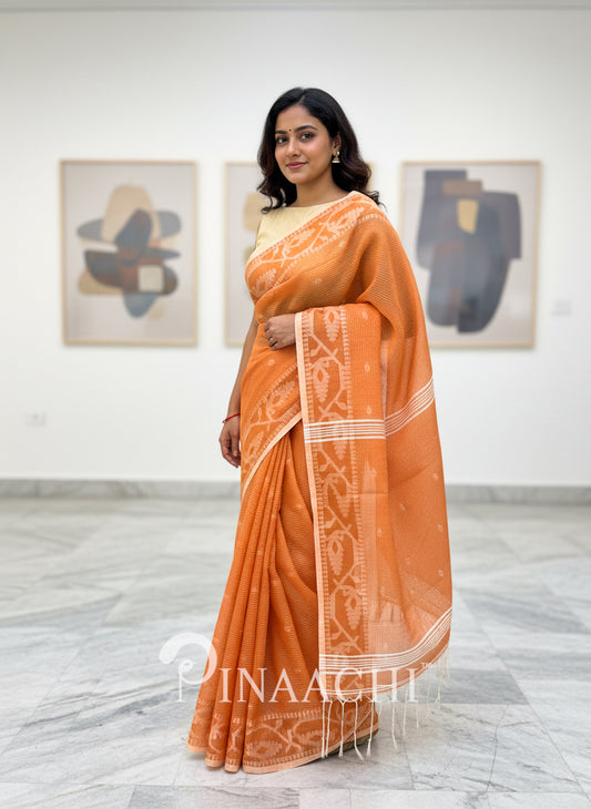 Pinaachi orange cotton silk jamdani saree with intricate patterns and elegant draping