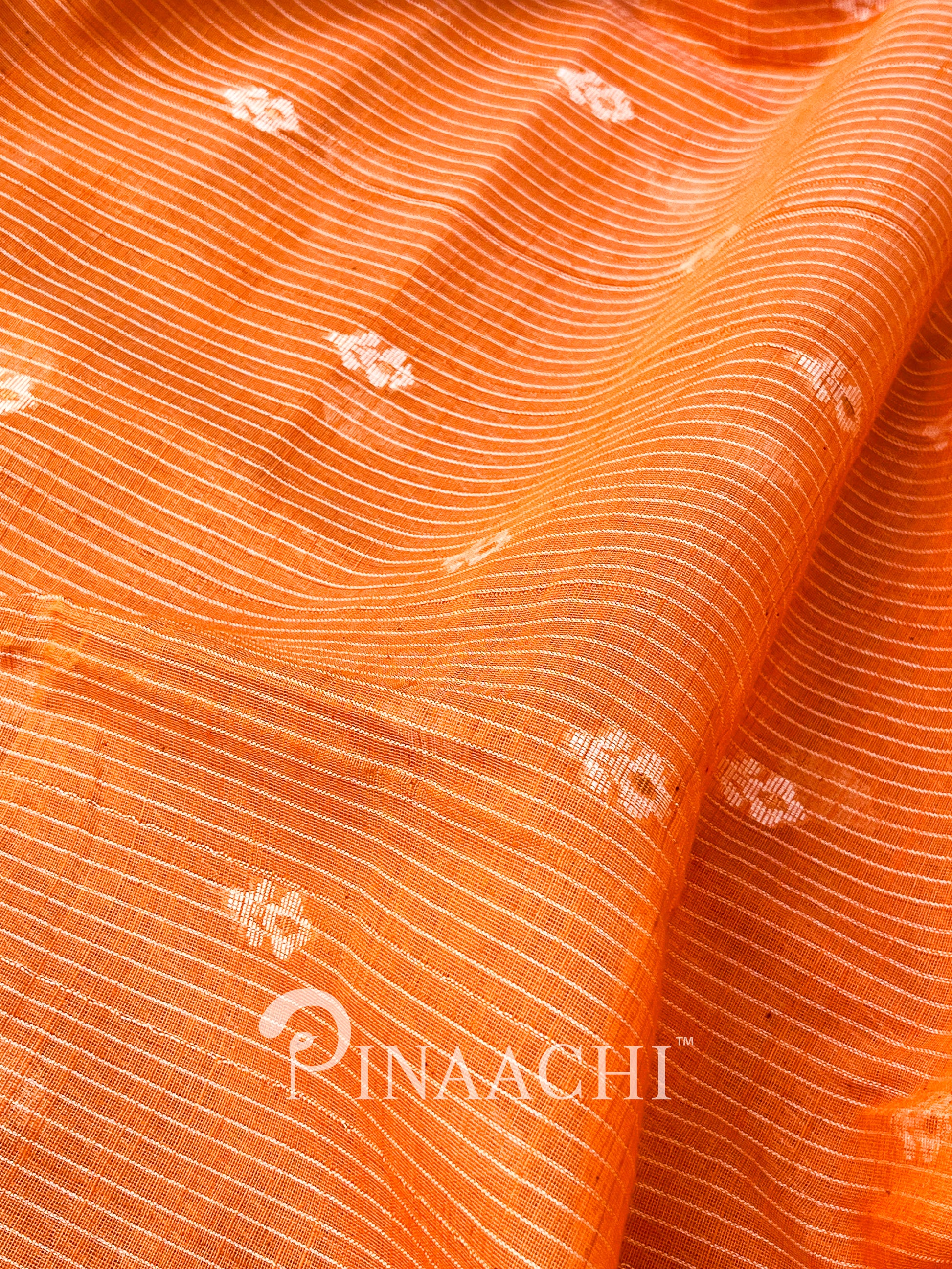 Pinaachi orange cotton silk jamdani saree with intricate floral patterns and fine textures