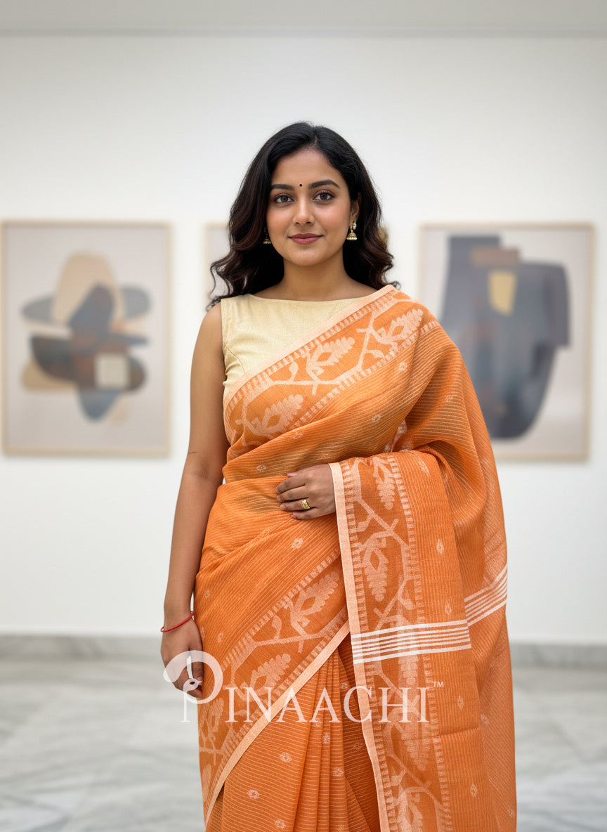 Pinaachi orange cotton silk jamdani saree with intricate designs and elegant drape