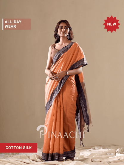 Elegant orange cotton silk saree from Pinaachi perfect for all-day wear, featuring stylish draping