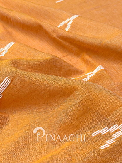 Pinaachi orange mulmul jamdani saree made from soft mulmul fabric with intricate weaving details