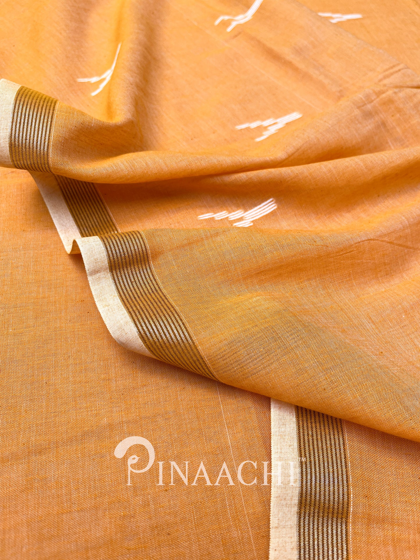 Pinaachi orange mulmul jamdani saree with elegant patterns and vibrant color