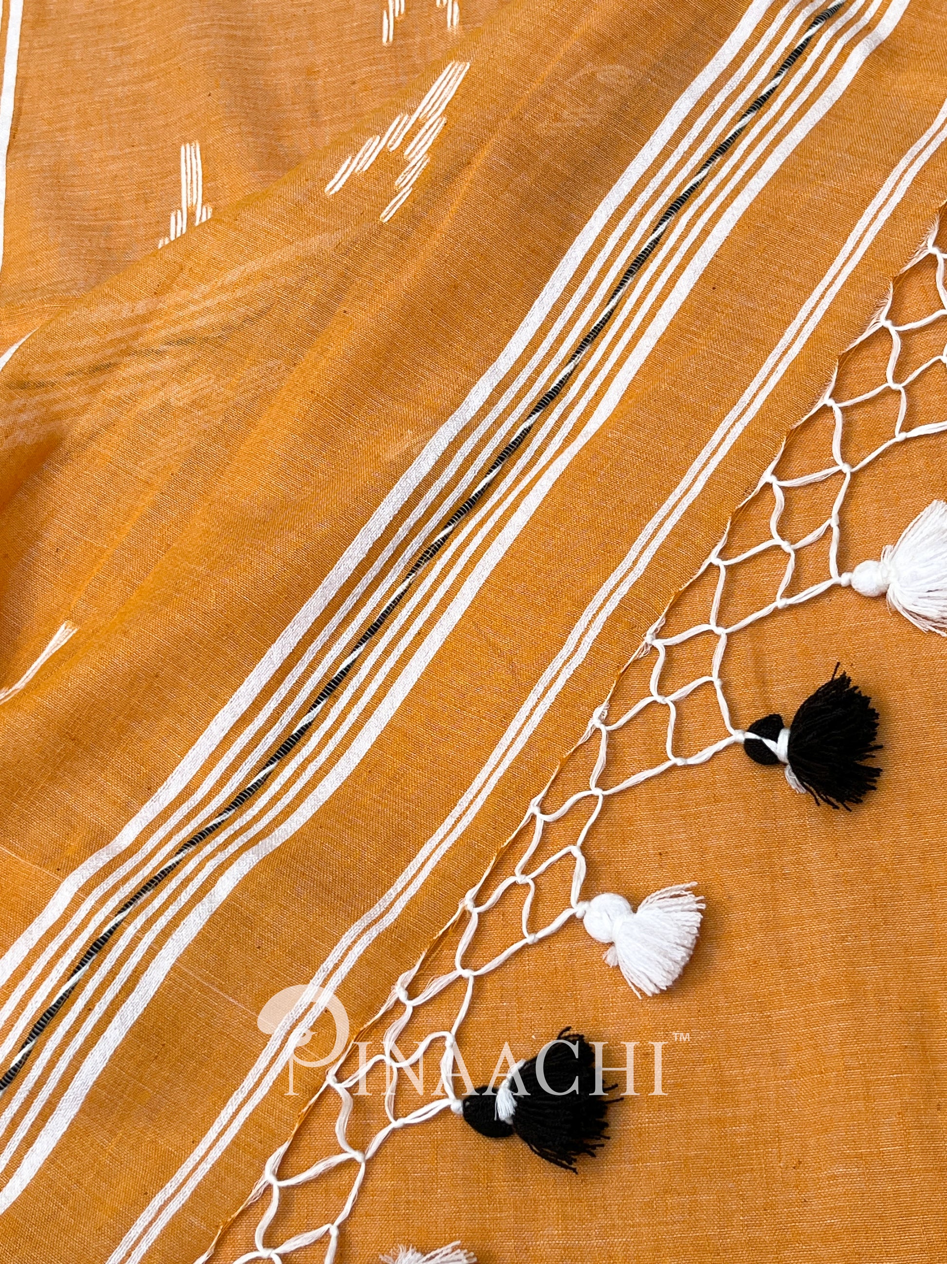 Pinaachi orange mulmul jamdani saree with traditional patterns and tassels