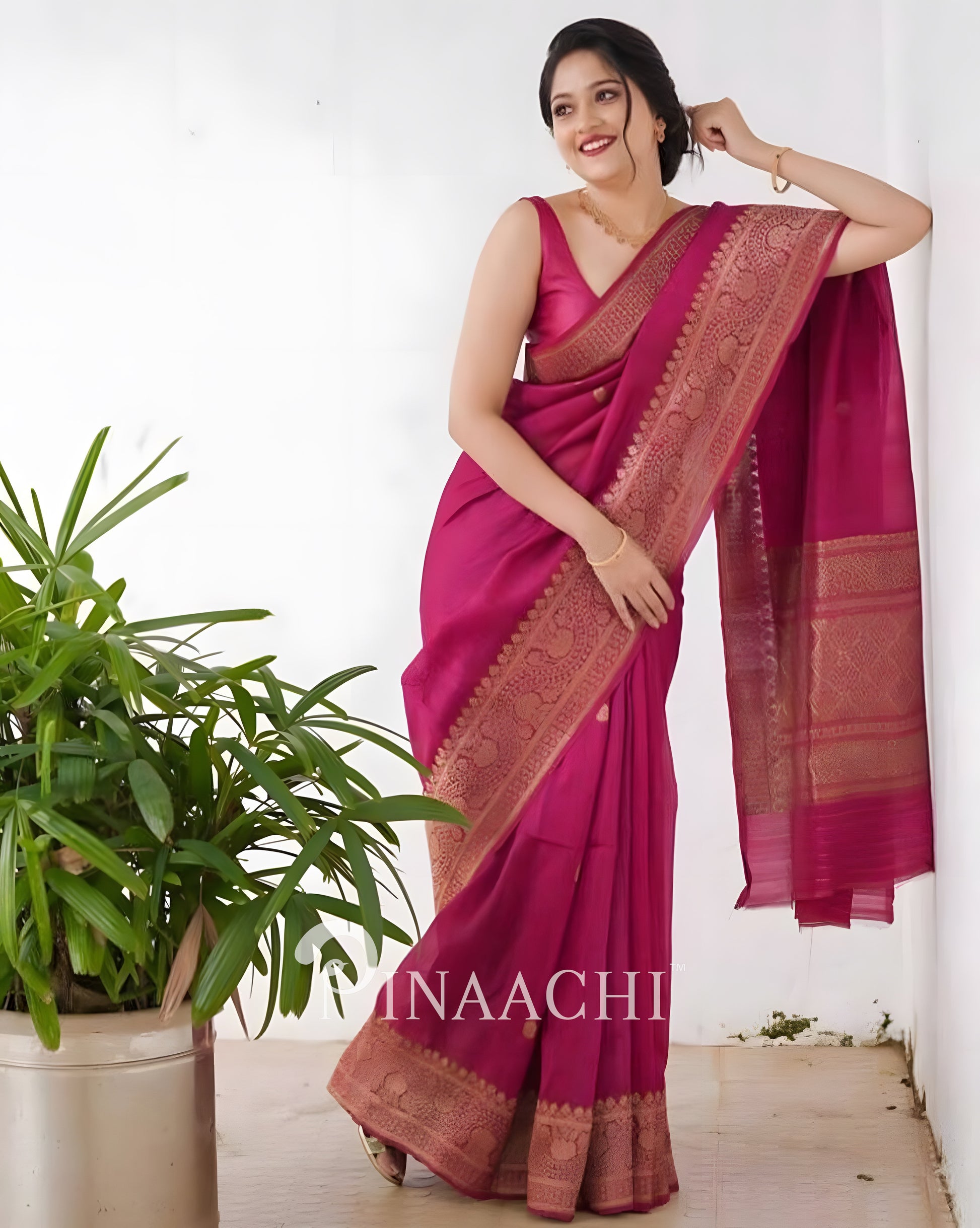 Elegant pink litchi silk saree by Pinaachi with intricate border design, perfect for special occasions