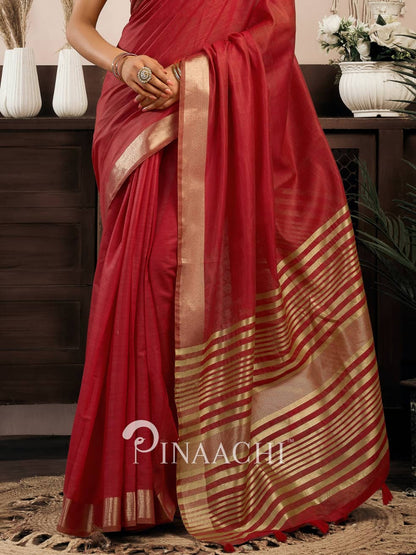 Elegant red cotton silk saree with gold striped border perfect for festive occasions