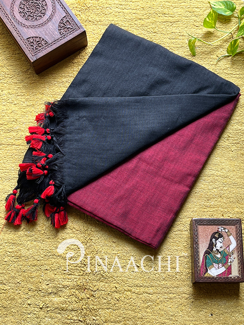 Red dual color cotton saree by Pinaachi with black tassels and a soft finish for elegant occasions.