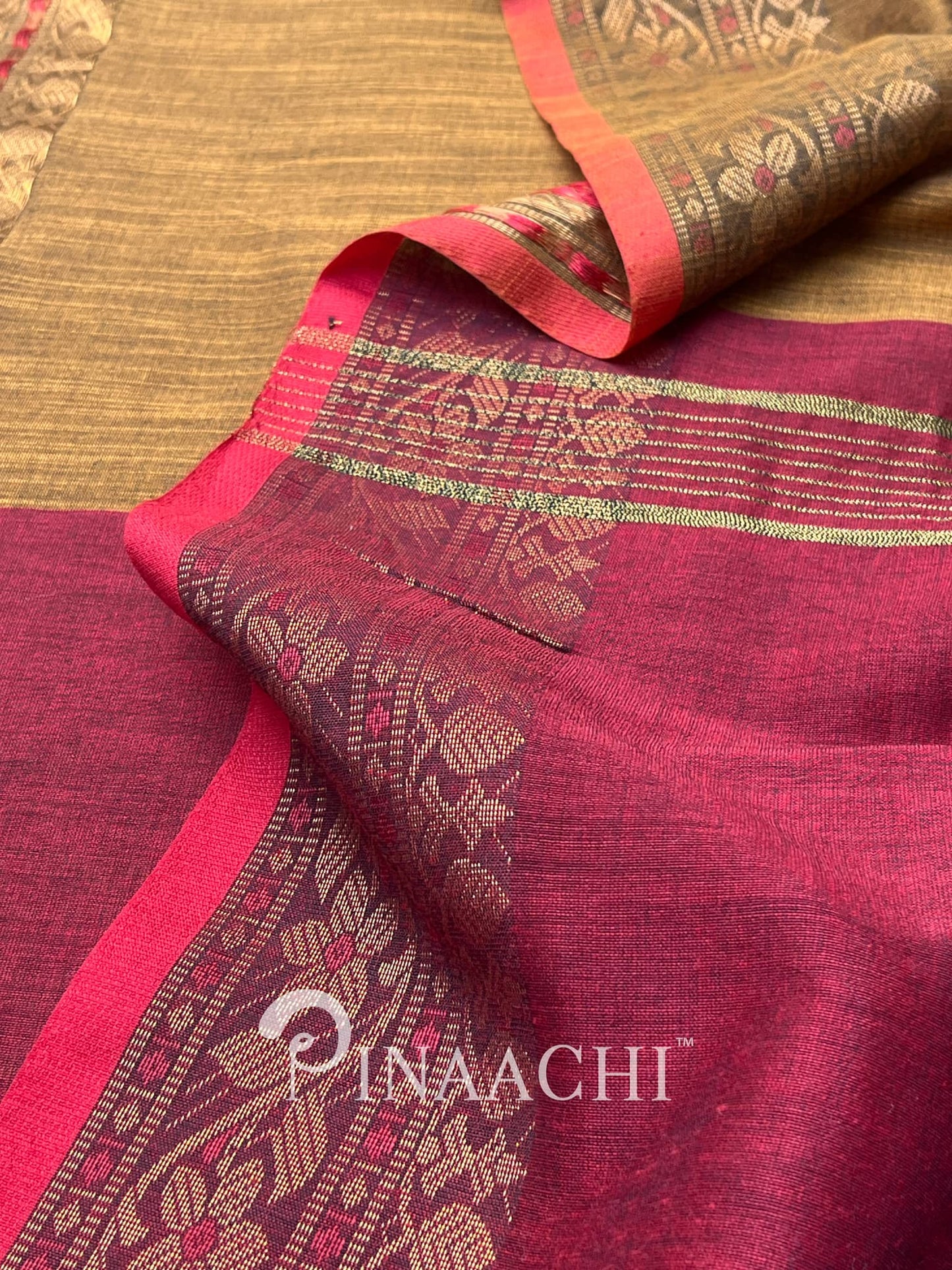 Pinaachi smoked mustard cotton silk saree with intricate gold motifs and vibrant borders