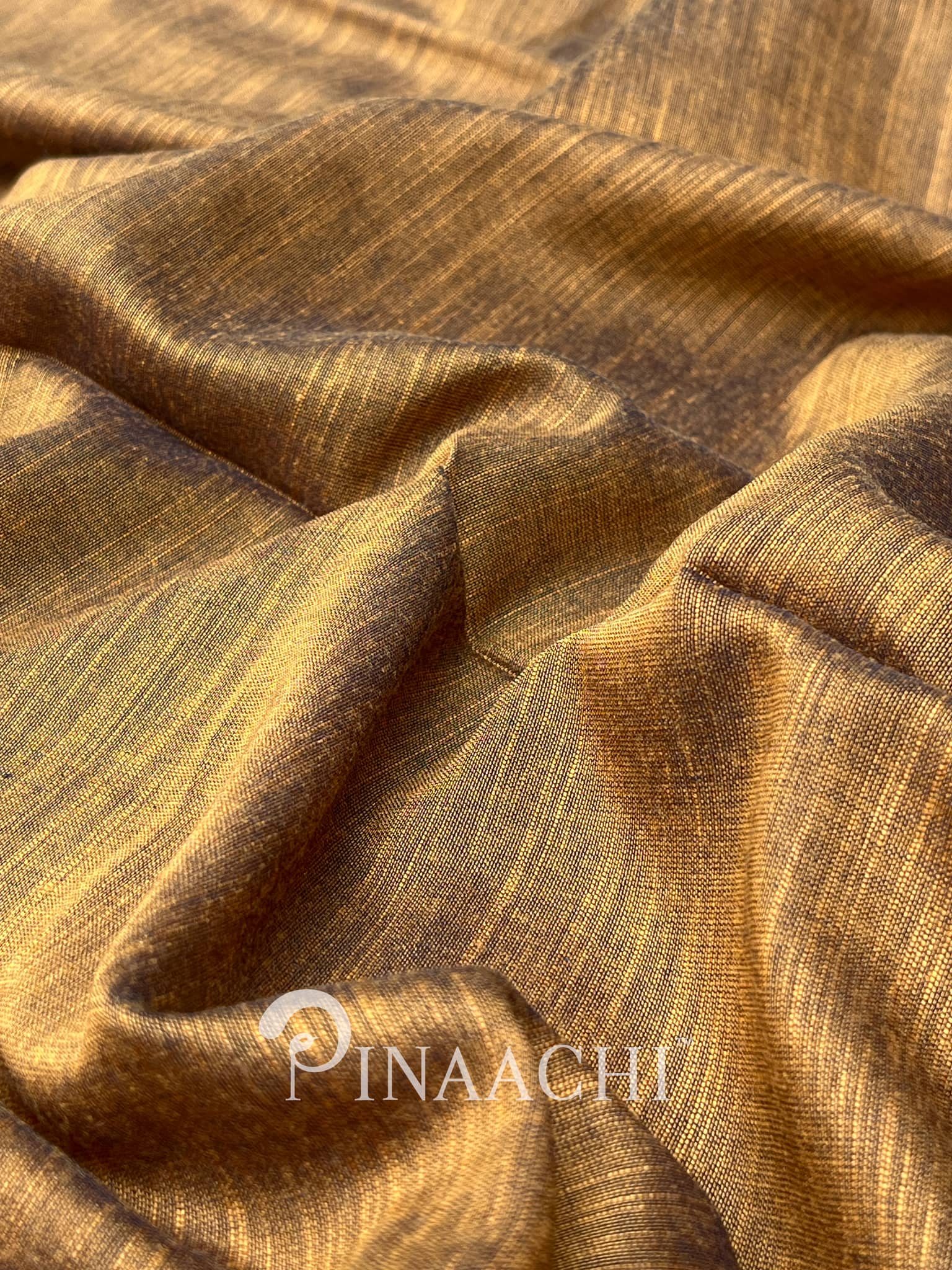 Pinaachi smoked mustard cotton silk saree with a rich texture and vibrant color