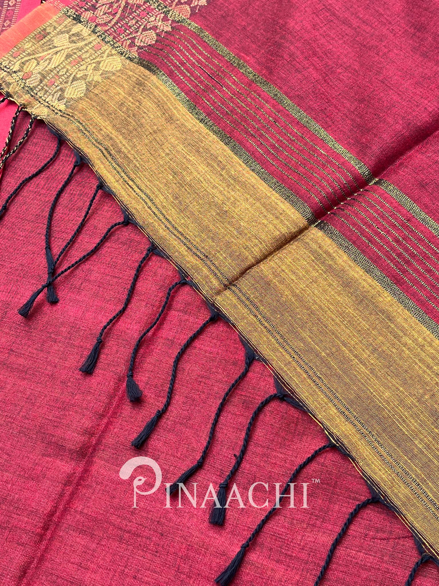 Pinaachi smoked mustard cotton silk saree with elegant border and tassels for festive occasions