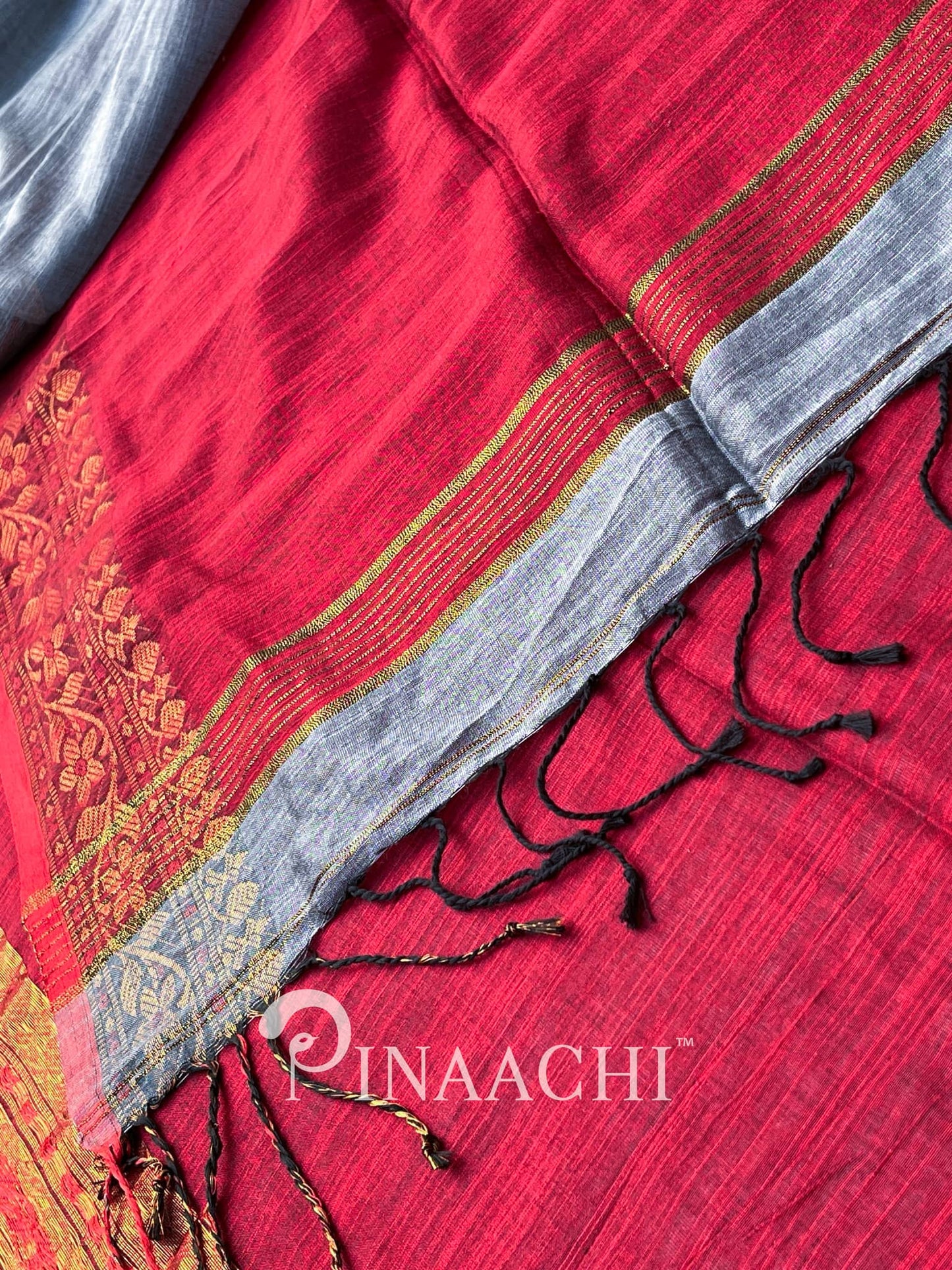 Pinaachi steel blue cotton silk saree with elegant gold detailing and tassels