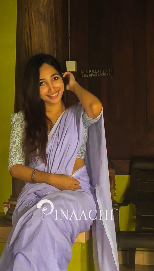 Woman wearing a lavender cotton handloom saree with a stylish blouse, showcasing elegance and comfort