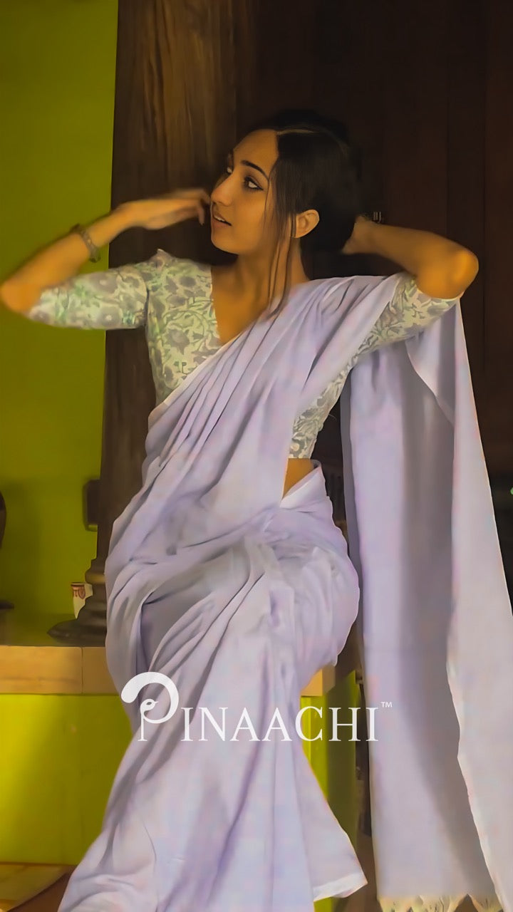 Elegant lavender cotton handloom saree styled with a floral blouse for a graceful look