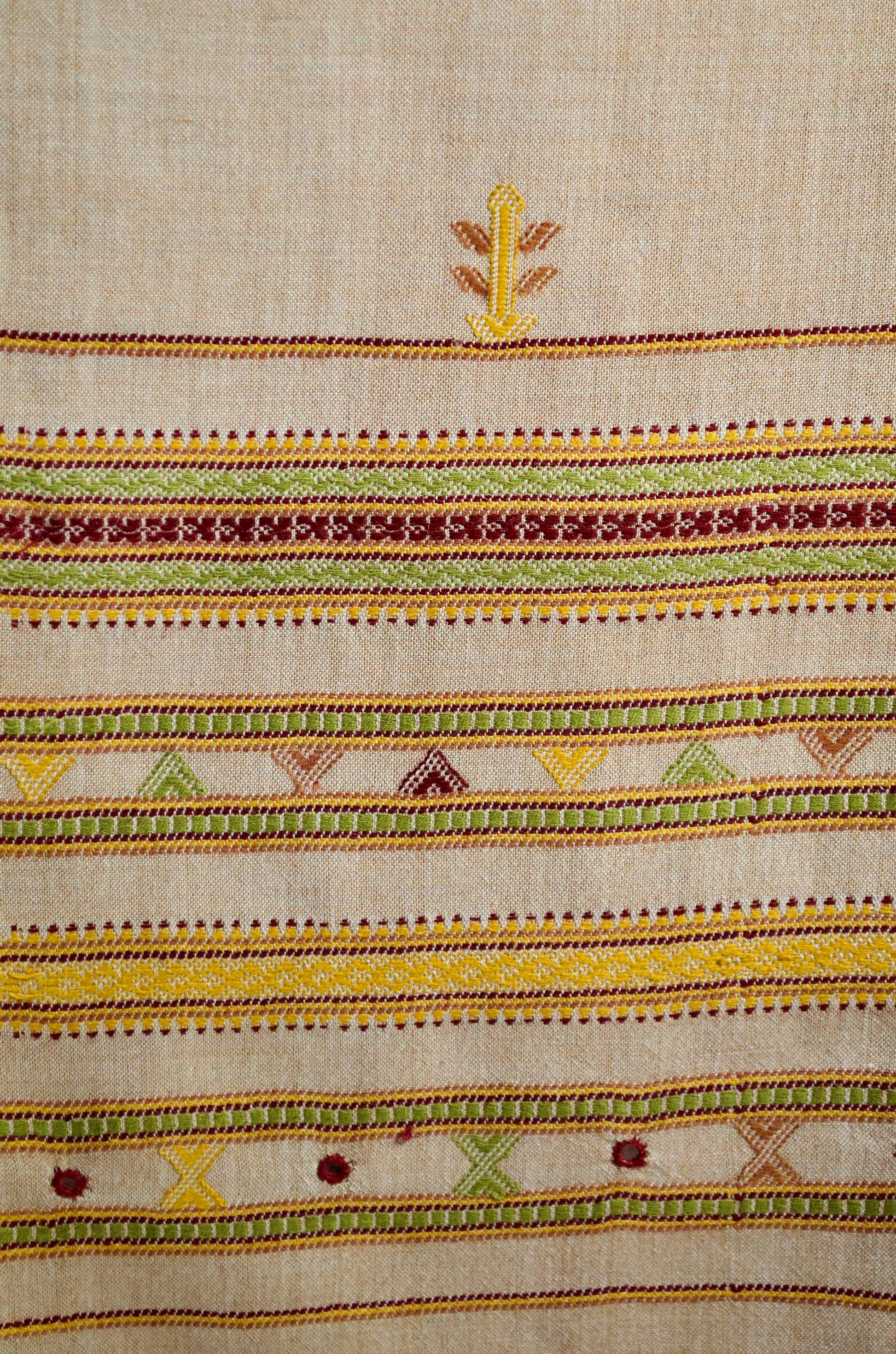 Elegant pure merino wool stole with vibrant hand-stitched patterns and rich colors