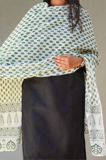 Sanganeri hand block printed dupatta in green floral design draped elegantly over a black outfit